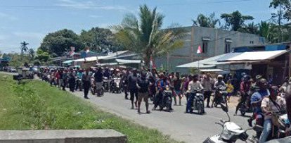 Twenty people die on the first of two days of rioting in Papua and West Papua ov