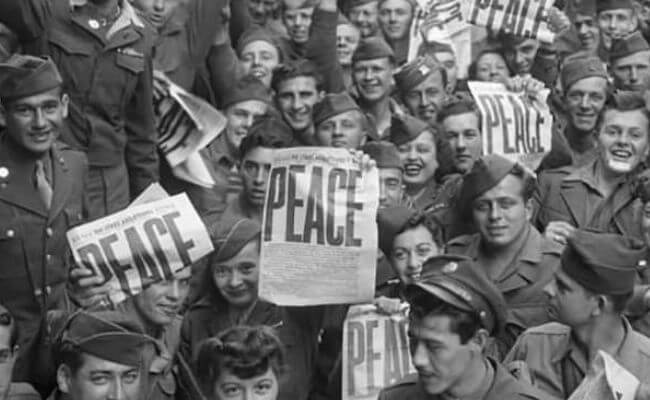 American military personnel celebrate Japan’s surrender and the end of World War II